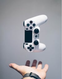 Picture of a game controller and a person's hand